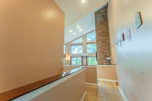 a hallway with a long counter and a window at Charming Lakefront Getaway with Hot Tub & Game Room Perfect for Families! in East Stroudsburg