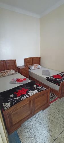 two twin beds sitting in a room at Dar Assalam 1 in Oualidia