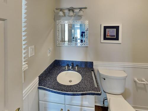 a bathroom with a sink and a toilet at Baylin B #11B in Topsail Beach