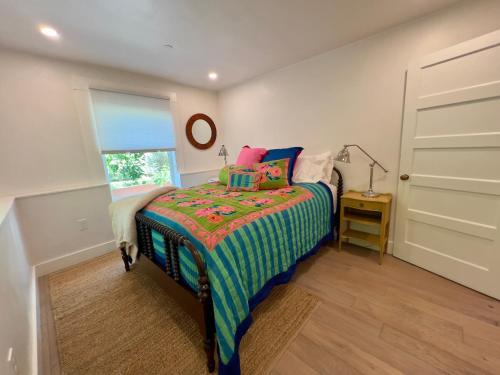 Voodi või voodid majutusasutuse Pied-à-Terre Courtyard Luxury Guest Suite toas