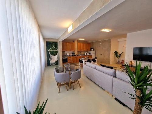 a living room with a couch and a table at Firstfloorby22 in Matosinhos