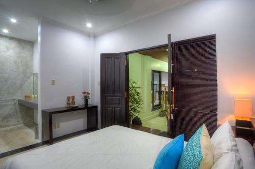 Ένα ή περισσότερα κρεβάτια σε δωμάτιο στο Kedis Bali Villa
