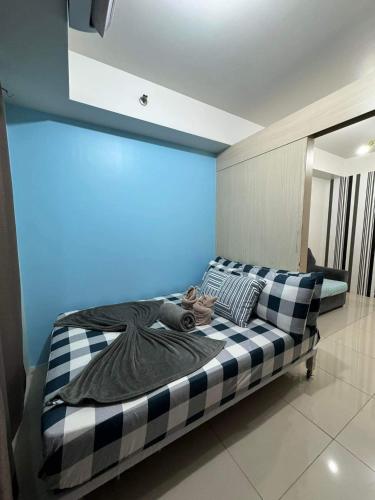 Postel nebo postele na pokoji v ubytování Sea Residences JEREMIAH2911