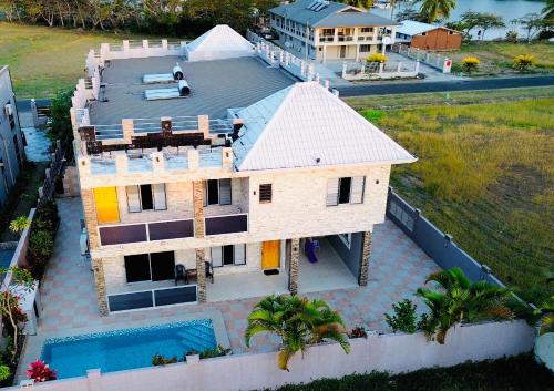 an aerial view of a house with a swimming pool at Happiness Home FiJi in Narewa