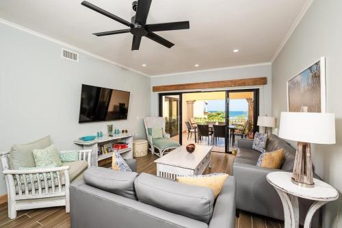 a living room with a couch and a ceiling fan at Wake Up to Ocean Views, Pool, Walk to Sandy Beach in Tamarindo