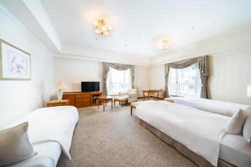 Postel nebo postele na pokoji v ubytování KOKO HOTEL Osaka Shinsaibashi