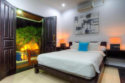 Llit o llits en una habitació de Kedis Bali Villa