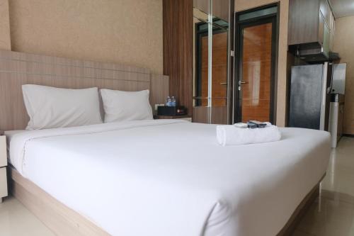 Postel nebo postele na pokoji v ubytování Homey Studio Apartment at Gateway Pasteur By Travelio
