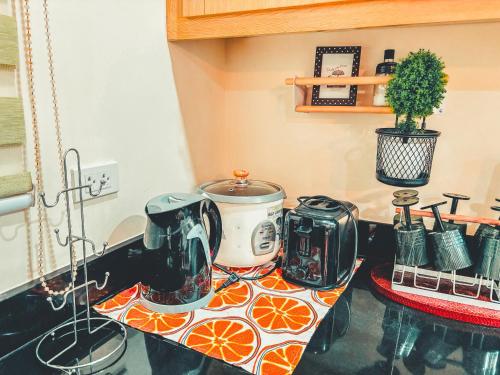 a kitchen with a counter top with a toaster and a toaster at Insta-Worthy Swiss House Staycation Crosswinds Tagaytay in Tagaytay