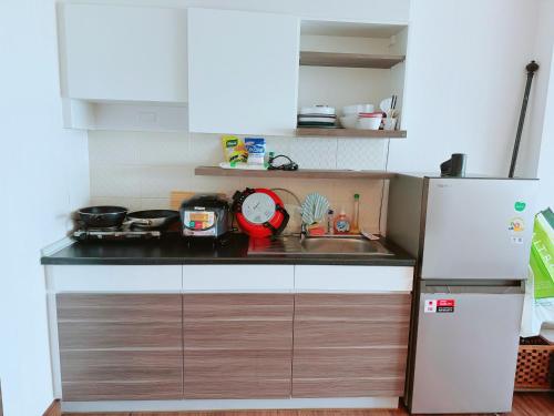 Kuchyň nebo kuchyňský kout v ubytování supalai monte II swimming condo