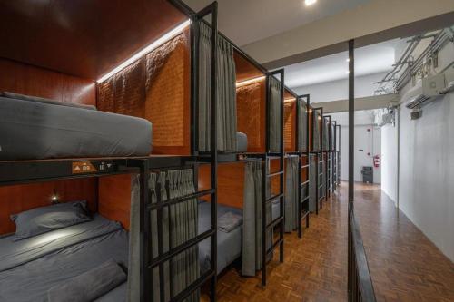 a row of bunk beds in a hallway at Ed Hostel Rachamakka in Chiang Mai
