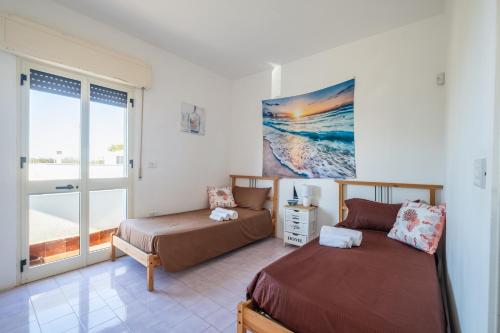 Ένα ή περισσότερα κρεβάτια σε δωμάτιο στο Villa Salsedine