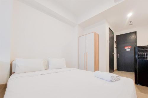 Ένα ή περισσότερα κρεβάτια σε δωμάτιο στο Modern Look Studio Room Collins Boulevard Apartment By Travelio