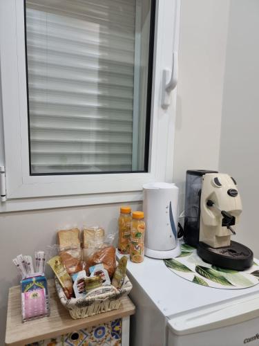 a counter with food and a coffee maker on it at La Trinacria casa vacanze in Bronte