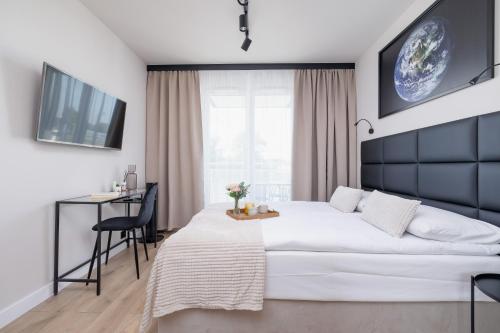 Posteľ alebo postele v izbe v ubytovaní Saska Blu Studios Premium by Noclegi Renters