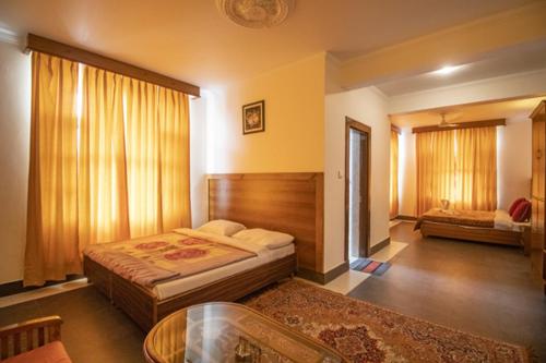 Кровать или кровати в номере WOW STAYZ2 Hotel The Lodge