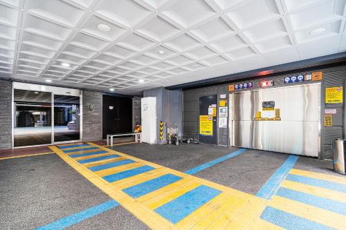 an empty parking garage with a gas pump at Rivertain Hotel Gyeongju in Gyeongju