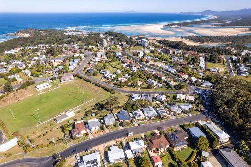 an aerial view of a suburb next to the ocean at Sasta Nambucca in Nambucca Heads