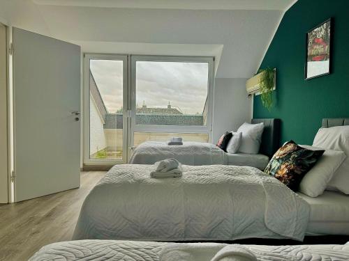 Postel nebo postele na pokoji v ubytování Stylische Wohnung in Koblenz