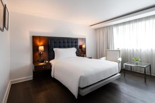 Letto o letti in una camera di Night Hotel Bangkok - Sukhumvit 15