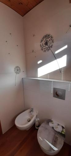 a bathroom with a toilet and a sink at Haus Sieben - Singer Lydia in Kötschach