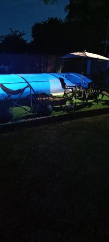 a blue and white plane sitting on the grass at L'Oustal in Montech
