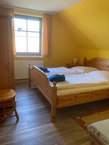 Postel nebo postele na pokoji v ubytování FeWo Lindenhof