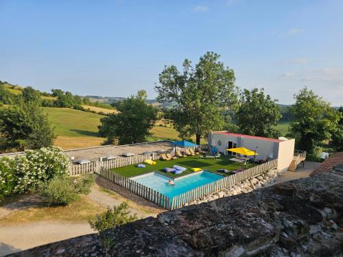 an aerial view of a house with a swimming pool at Domaine de Massoulac in Molières