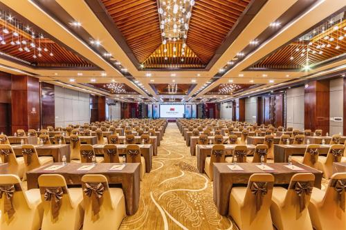 a large banquet hall with tables and chairs at Vietsovpetro Ho Tram Beach Resort & Spa in Ho Tram