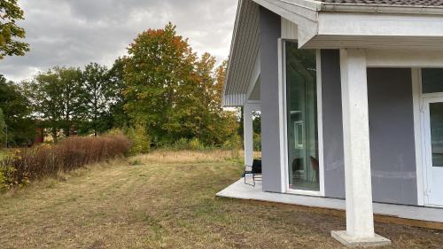 a porch of a house with a bench on it at Lorans in Perstorp