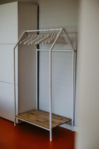 a metal structure with a wooden shelf in a room at Cozy Place in Müllendorf