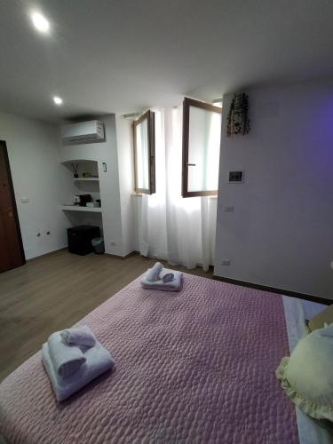 Ένα ή περισσότερα κρεβάτια σε δωμάτιο στο Blueroom ASSO