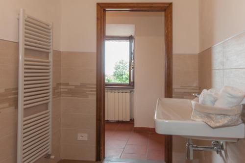 a bathroom with a sink and a window at Sant'Antonio in Volterra