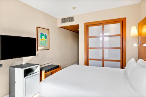 Katil atau katil-katil dalam bilik di B&B HOTEL Zaragoza Los Enlaces Estación
