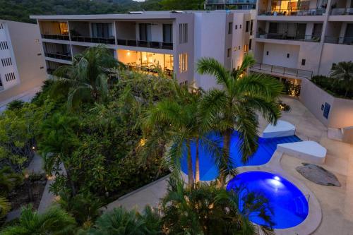 an aerial view of a building with palm trees at 2055 - Cosmo 8A2 in Santa Cruz Huatulco