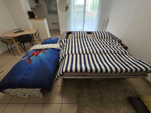 Ένα ή περισσότερα κρεβάτια σε δωμάτιο στο Super appartement familial Disneyland Paris 5pers