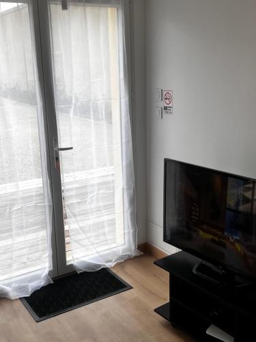 TV a/nebo společenská místnost v ubytování edendebruges