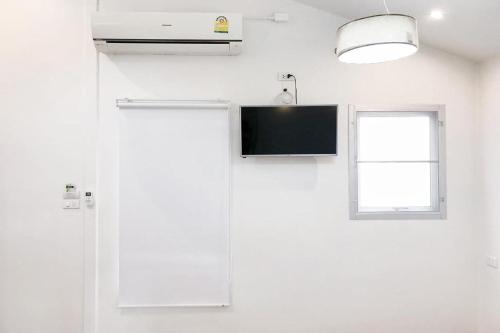 TV tai viihdekeskus majoituspaikassa Urban Bed