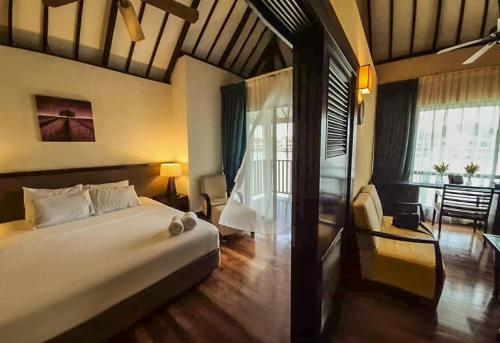 Ένα ή περισσότερα κρεβάτια σε δωμάτιο στο Avani Sepang Goldcoast Resort Family Villa