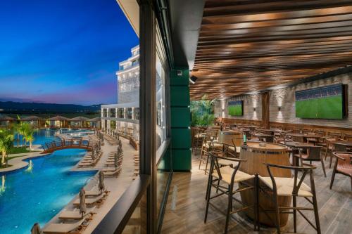 a rendering of a resort restaurant with a swimming pool at Grand Sapphire Residence By Aircyp in Iskele