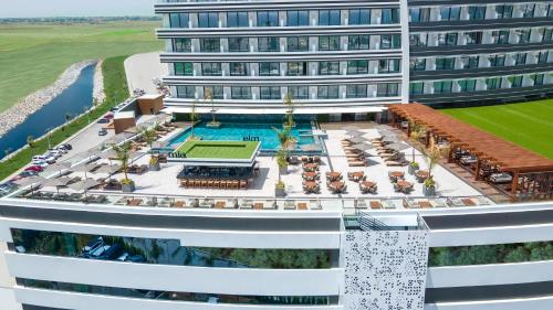 a rendering of a hotel with a pool and a tennis court at Grand Sapphire Residence By Aircyp in Iskele