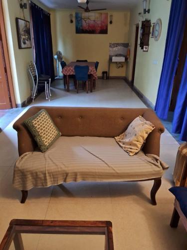 a couch in a living room with a table at Luxury Villa Large Private Pool in Raichak