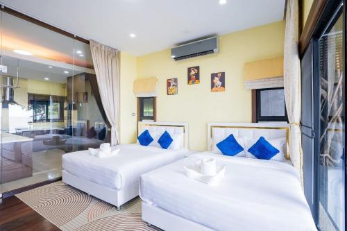 Katil atau katil-katil dalam bilik di Welcome Sea View Pool Villa