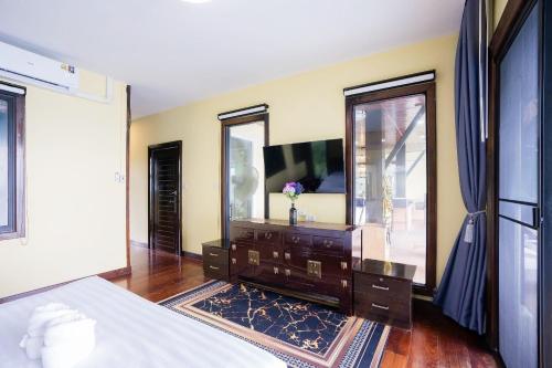 Katil atau katil-katil dalam bilik di Welcome Sea View Pool Villa