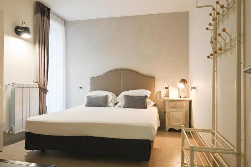Ένα ή περισσότερα κρεβάτια σε δωμάτιο στο Relais Palazzo Duomo B&B