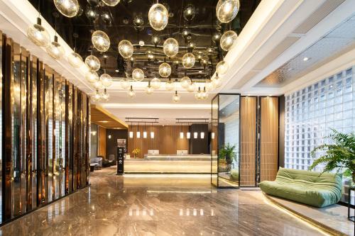 Posezení v ubytování Langham Honor International Hotel Canton Fair Complex Branch - Free Shuttle to Canton Fair Complex During Canton Fair Period & Free Mini Bar