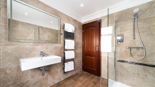 a bathroom with a sink and a shower at Westlands of Pitlochry in Pitlochry