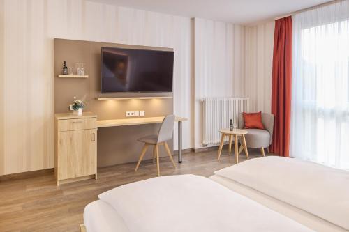 Ένα ή περισσότερα κρεβάτια σε δωμάτιο στο Hotel Zum Schiff