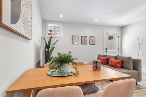 a living room with a table and a couch at Central 2-BR City Sanctuary - Commuter-Friendly in Washington, D.C.