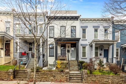 a large white house with a front door at Central 2-BR City Sanctuary - Commuter-Friendly in Washington, D.C.